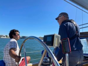 Dan at the helm and Martin talking