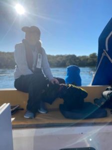 Tess sitting in the cock pit with Nitro (the dog)